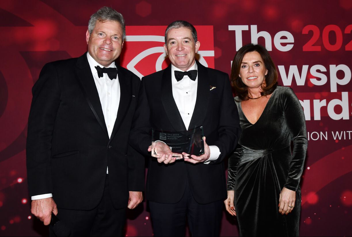 IntoMedia CEO Dominic Fitzpatrick, centre, receiving the Regional Newspaper of the Year award for The Irish News in London on Tuesday